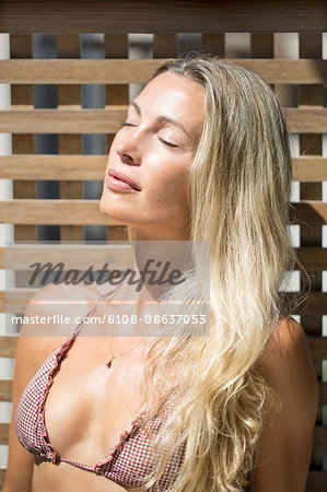 Close-up of young  woman sunbathing
