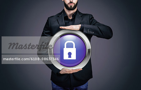 Businessman holding a circle containing the symbol "padlock"