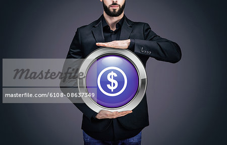 Businessman holding a circle containing the symbol "Dollar"