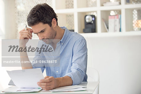 Man frustrated by mounting debt Man frustrated by mounting debt