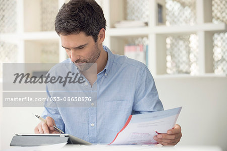 Man using online banking to manage personal finances