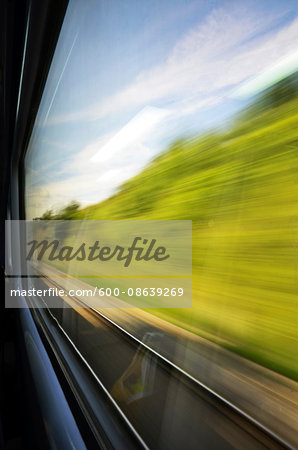 Looking out Speeding Train Window at Country Side