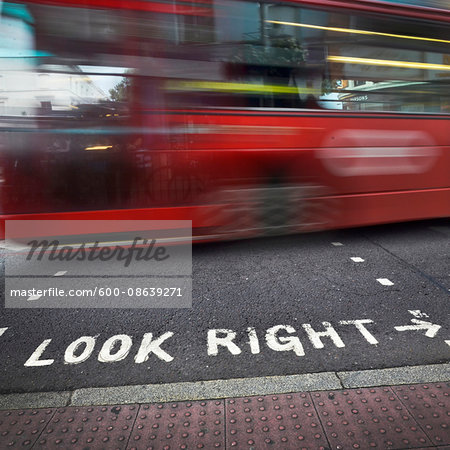 Look Right Sign at Crosswalk and Speeding Double Decker Bus, London, England, UK Look Right Sign at Crosswalk and Speeding Double Decker Bus, London, England, UK