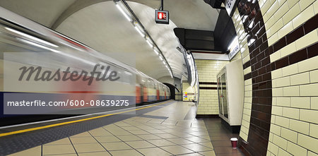 View of London Underground Platform at Edgware Road with Train Leaving, London, England, UK