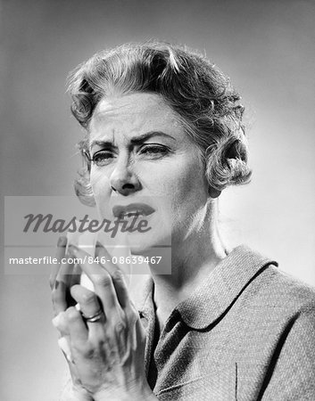 1960s MATURE WOMAN ABOUT TO SNEEZE