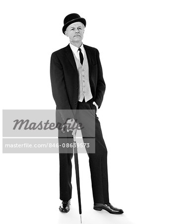1960s PORTRAIT FULL LENGTH MAN WEARING THREE PIECE SUIT BOWLER HAT HOLDING AN UMBRELLA VERY BRITISH ENGLISH LOOK 1960s PORTRAIT FULL LENGTH MAN WEARING THREE PIECE SUIT BOWLER HAT HOLDING AN UMBRELLA VERY BRITISH ENGLISH LOOK