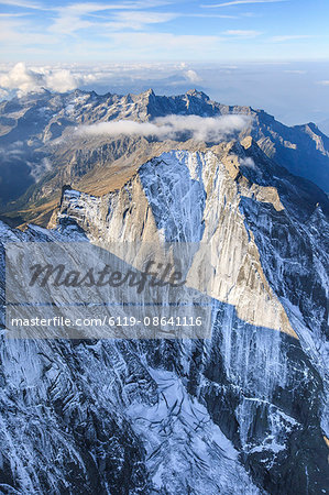 Aerial view of the north face of Piz Badile located between Masino and Bregaglia Valley, border of Italy and Switzerland, Europe