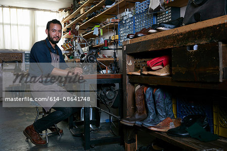 Portrait of male cobbler in traditional shoe workshop