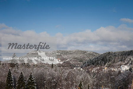 Sweden, Medelpad, Nolby, Nolbybacken, View of mountain range in winter