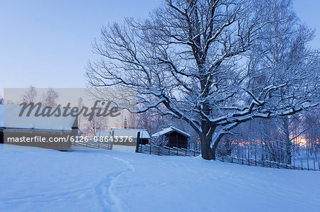 Sweden, Dalarna, Mora, Wooden houses covered with snow