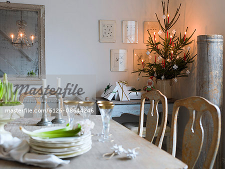 Sweden, Elegant dining table and Christmas tree in living room