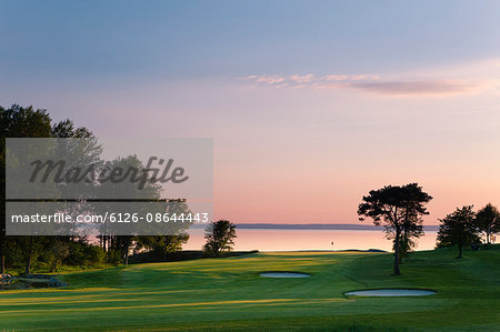 Sweden, Ostergotland, View of Lake Vattern by Ombergs Golf Resort at sunset