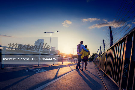 Sweden, Stockholm, Couple walking on bridge