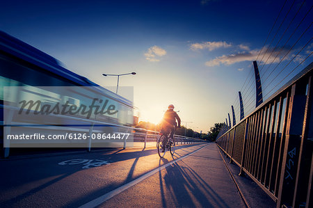 Sweden, Stockholm, Cyclist and bus on bridge