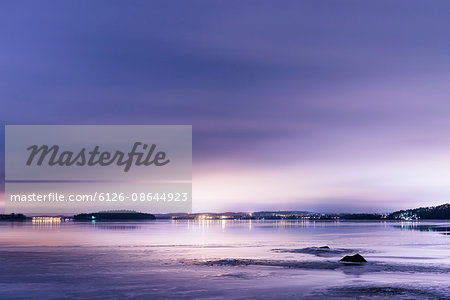 Finland, Pirkanmaa, Tampere, Pyhajarvi, Lake under purple sky at dusk