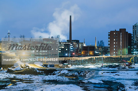 Finland, Pirkanmaa, Tampere, Construction site in winter at dusk