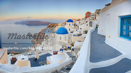 White houses and blue domes of the churches dominate the Aegean Sea, Oia, Santorini, Cyclades, Greek Islands, Greece, Europe