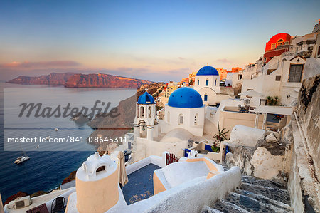 White houses and blue domes of the churches dominate the Aegean Sea, Oia, Santorini, Cyclades, Greek Islands, Greece, Europe