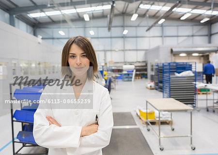 Portrait confident female engineer in steel factory