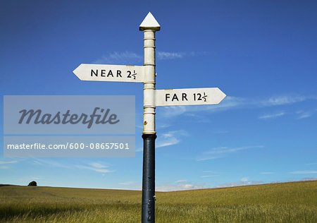 Old Country Sign Post with Near and Far as Destinations Old Country Sign Post with Near and Far as Destinations
