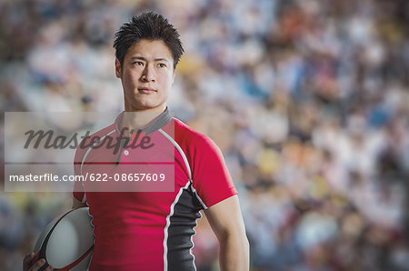 Portrait of Japanese rugby player with ball