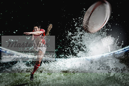Portrait of Japanese rugby player kicking