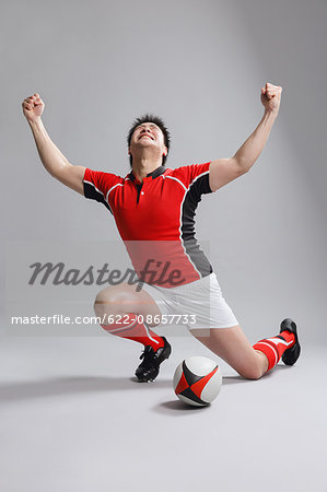 Portrait of Japanese rugby player cheering up