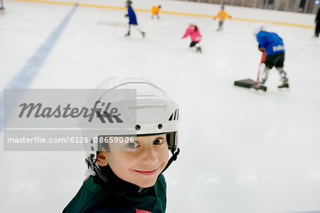 Sweden, Portrait of young male hockey player (4-5) on ice