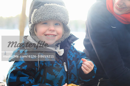 Sweden, Uppland, Lanna, Smiling little girl (2-3) wearing fur hat
