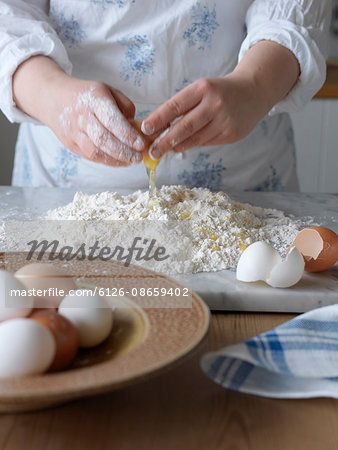Sweden, Woman making pasta dough