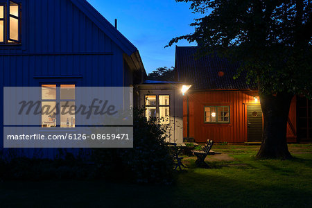 Sweden, Oland, Illuminated houses at dusk