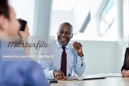 Laughing businessman enjoying meeting Laughing businessman enjoying meeting