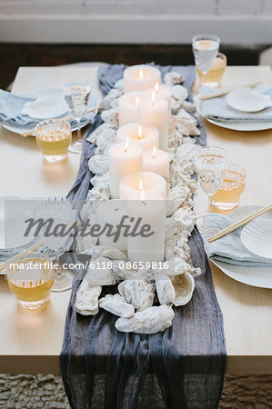 Place settings at a table dressed for an occasion.