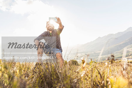 Man taking selfie on sunny day, Franschhoek, South Africa