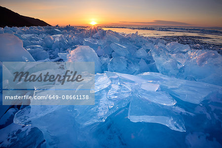 Stacked broken ice at sunset, Baikal Lake, Olkhon Island, Siberia, Russia