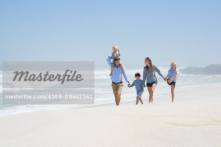 Family walking on the beach