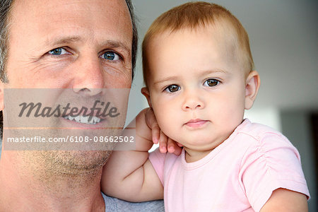 Close-up of a mature man with her daughter