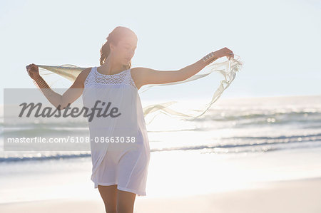 Attractive young woman enjoying on the beach