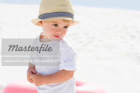 Close-up of a baby boy on the beach