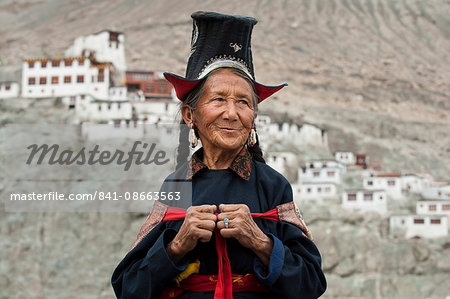 A Nubra woman wears traditional dress to attend a gathering at a local monastery in the Nubra Valley, Ladakh, India, Asia
