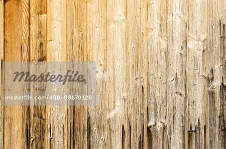 Old planked wood used as background. Wood panelling. Single planks are nailed to one surface. Photo.