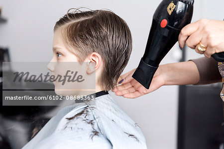 Boy at hairdresser