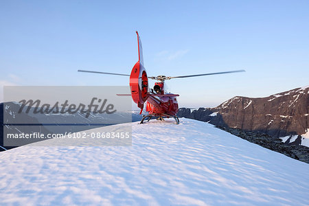 Helicopter on snowy peak