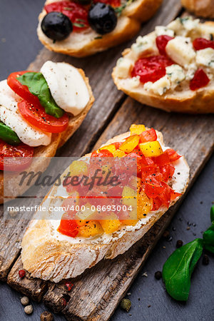 Italian bruschetta with chopped tomatoes, herbs and oil on toasted crusty ciabatta bread