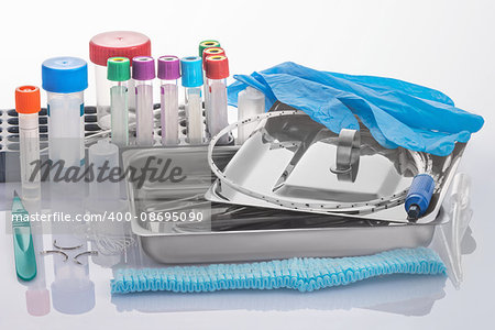 Medical tools in a tray from stainless steel and expendables for clinical laboratory