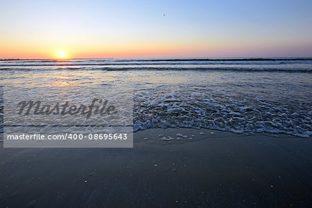 Radiant sea beach sunrise in summer time