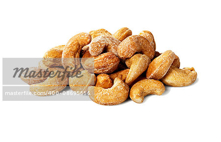 Studio shot of heap of cashew nuts isolated on white background.