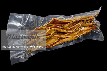 vacuum packed cold smoked Baikal omul on the black background