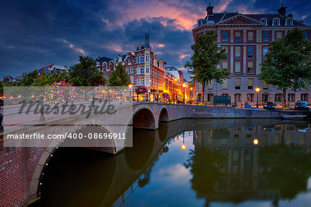 Image of Amsterdam, Netherlands during dramatic sunrise.