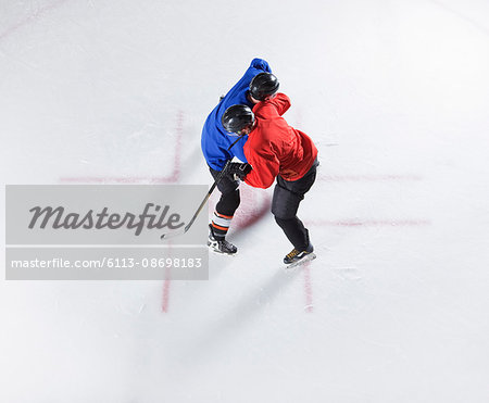 Overhead view hockey opponents colliding